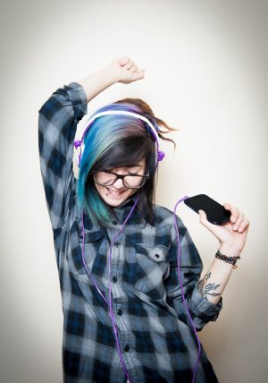 person-with-bright-hair-listening-to-music-300x428